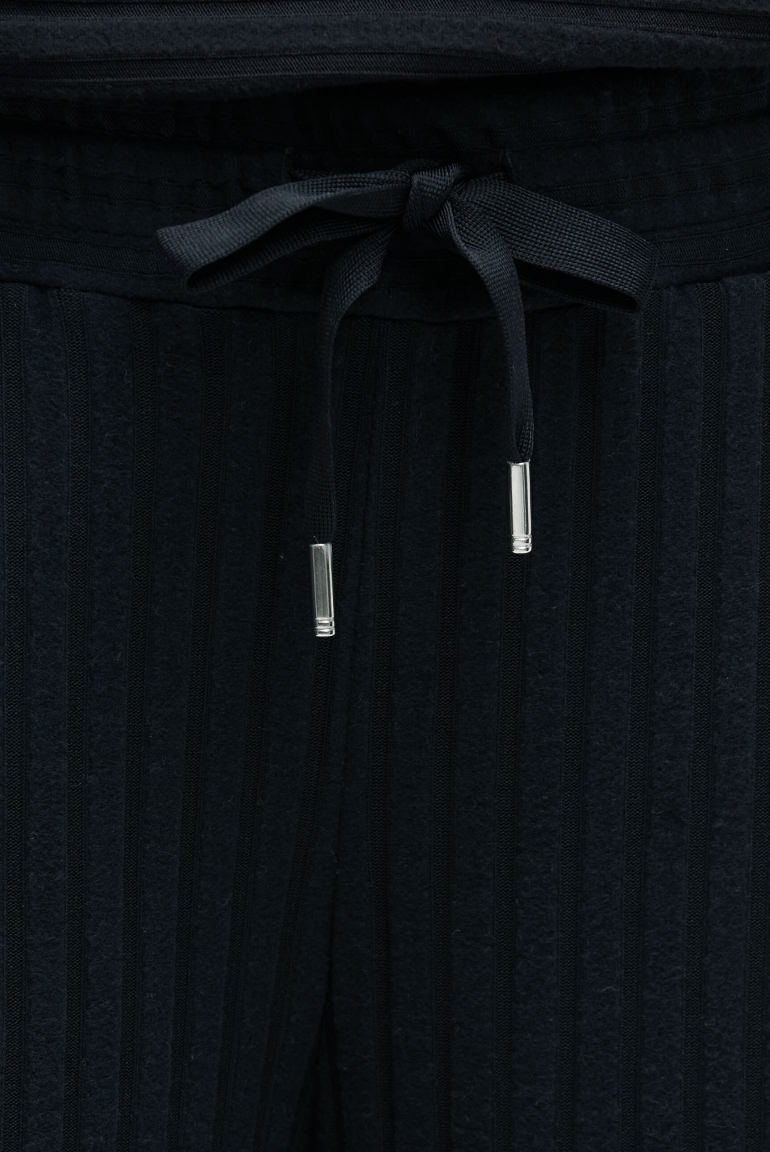 Flaušové pletené kalhoty se širokými nohavicemi a žebrovanou strukturou