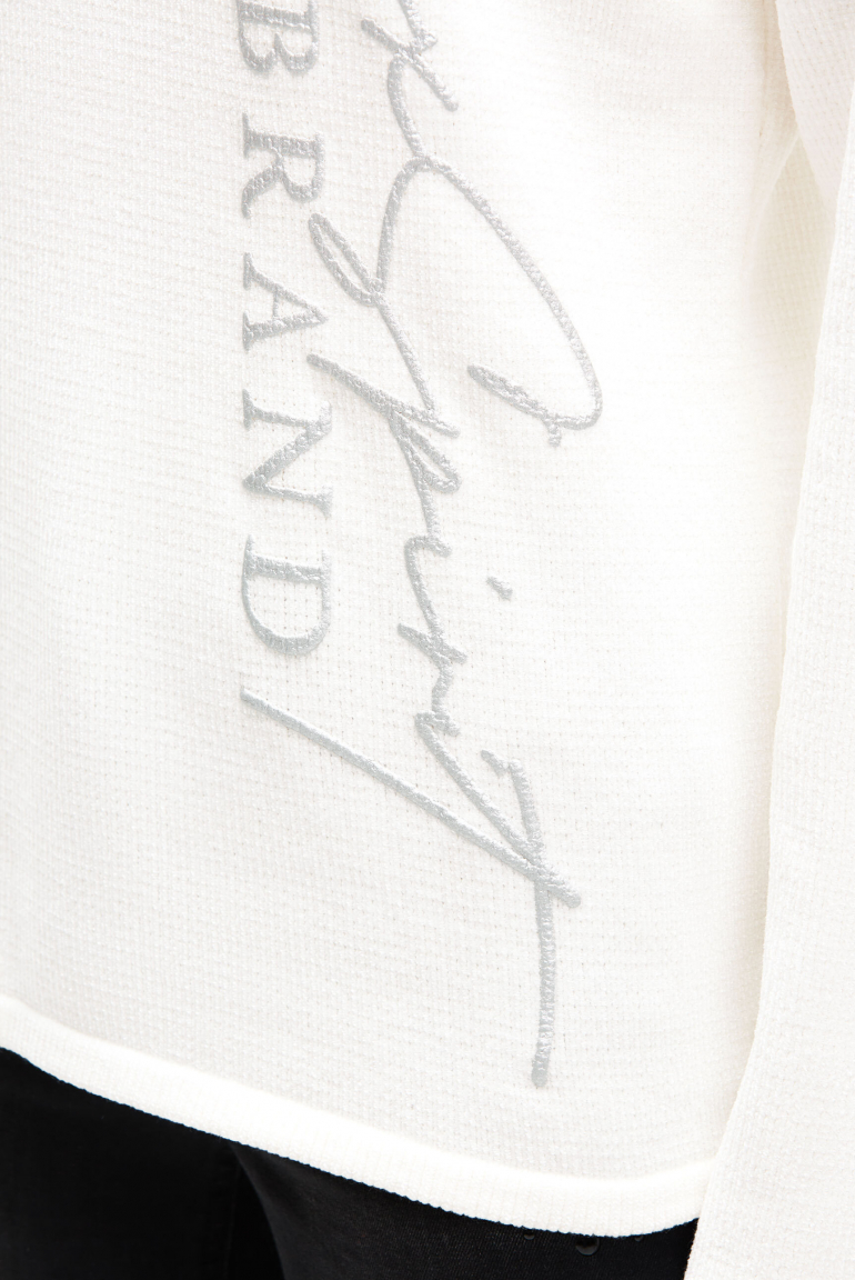 Žinylkový svetr s vysokým límcem a artworkem