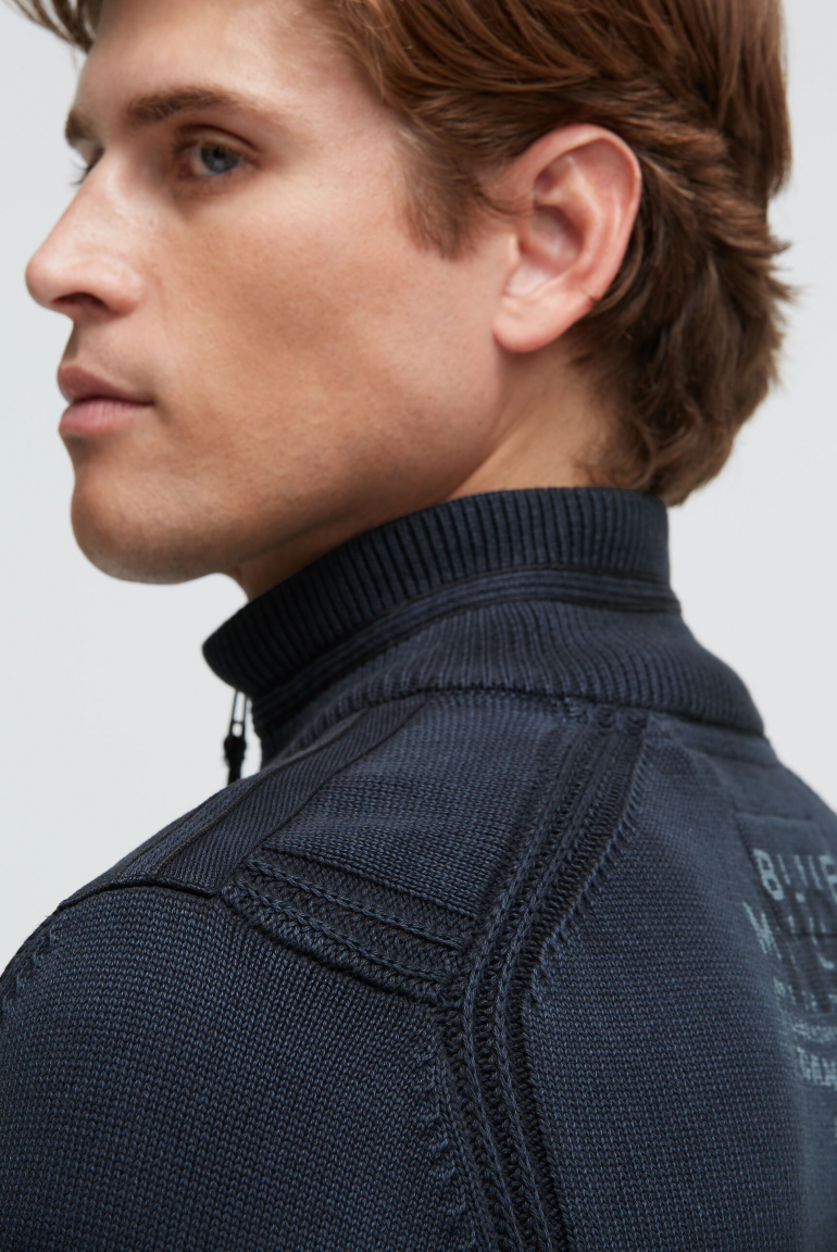 Troyer svetr se zipem, pásky a potisky