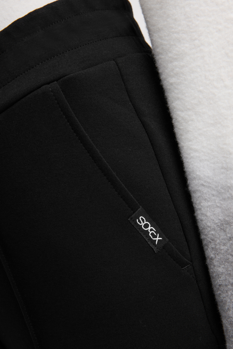 Široké kalhoty s elastickým pasem a prošíváním